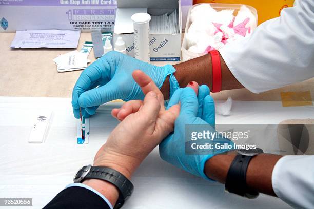 American Ambassador, Donald Gips gets tested for HIV to help raise awareness of the illness in preparation of World AIDS Day on November 4, 2009 in...