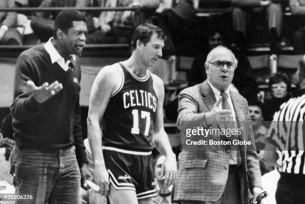 Boston Celtics green coach Bill Russell, left and white coach Red Auerbach, right, argue with an official as John Havlicek stands by, middle, during...