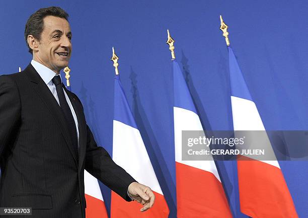 French President Nicolas Sarkozy arrives to deliver a speech on economic recovery after a visit at the industrial group CNIM , on December 1, 2009 in...