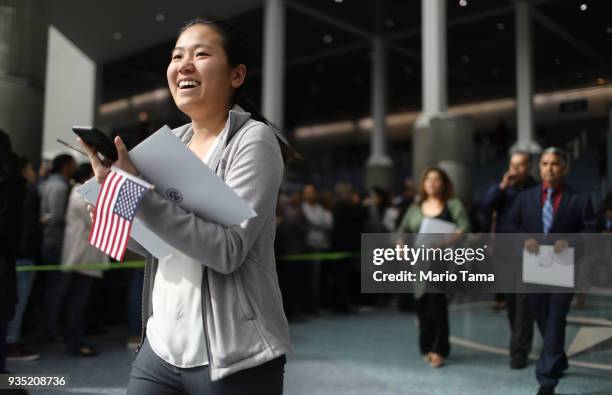 New U.S. Citizen smiles while departing a naturalization ceremony on March 20, 2018 in Los Angeles, California. The naturalization ceremony welcomed...