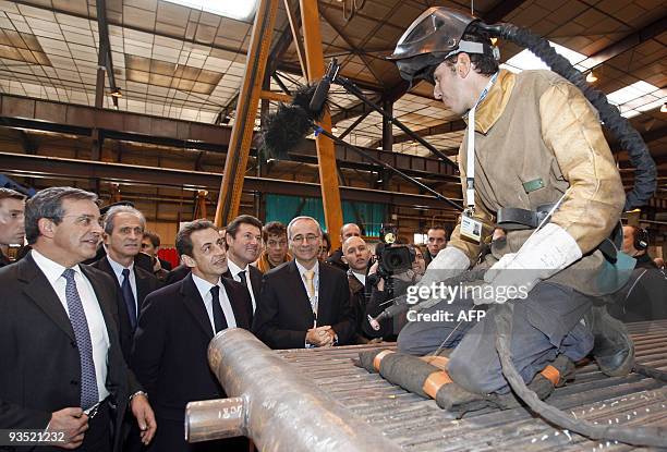 French President Nicolas Sarkozy talks with an employee during a visit at the industrial group CNIM , on December 1, 2009 in La Seyne-sur-Mer ,...