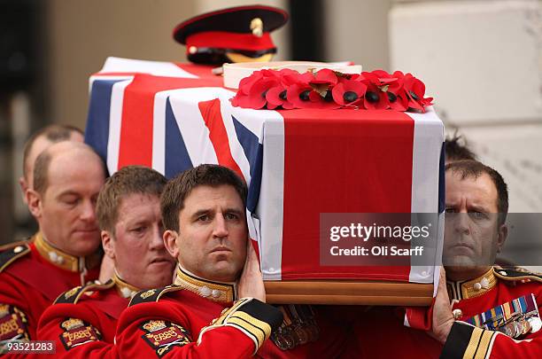The coffin of Warrant Officer Class One Regimental Sergeant Major Darren Chant of the Genadier Guards is carried out of the Guards Chapel on the...