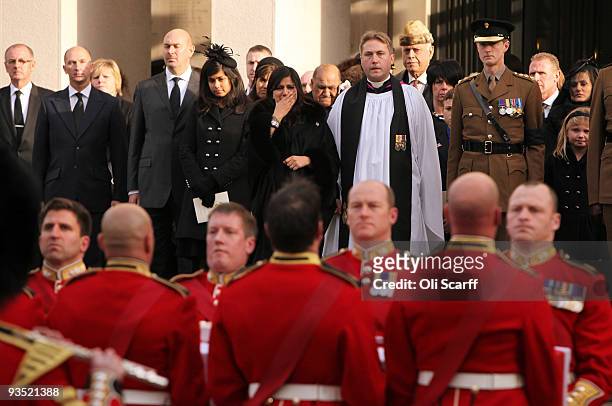 Nausheen Chant , the wife of Warrant Officer Darren Chant, grieves as her husband's coffin is carried out of the Guards Chapel on the Wellington...