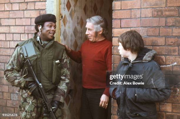 British soldier receives a warm welcome from a resident while on street patrol in the sectarian divide of north Belfast, 21st January 1972.