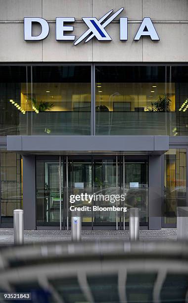 The Dexia company logo hangs on the central branch and administrative building of Dexia SA, in Brussels, Belgium, on Monday, Nov. 30, 2009. European...