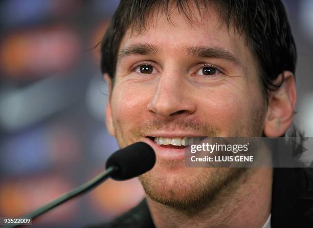 Barcelona's Argentinian forward Lionel Messi smiles during a press conference at the Ciutat esportiva Joan Gamper near Barcelona on December 1, 2009....