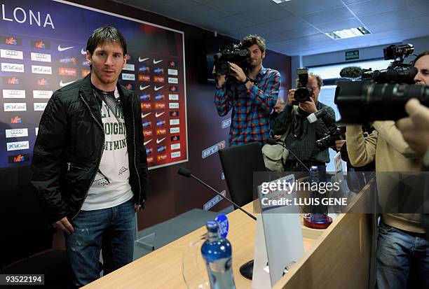 Barcelona's Argentinian forward Lionel Messi arrives at a press conference at the Ciutat esportiva Joan Gamper near Barcelona on December 1, 2009....