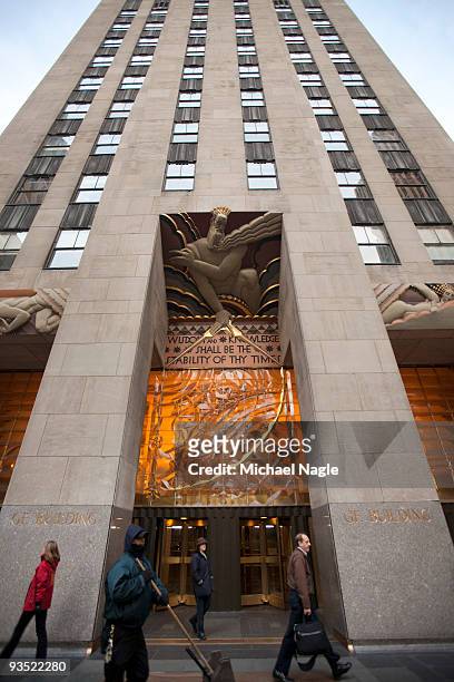Pedestrians walk in front of 30 Rockefeller Plaza, the headquarters of NBC and General Electric December 1, 2009 in New York City. General Electric...