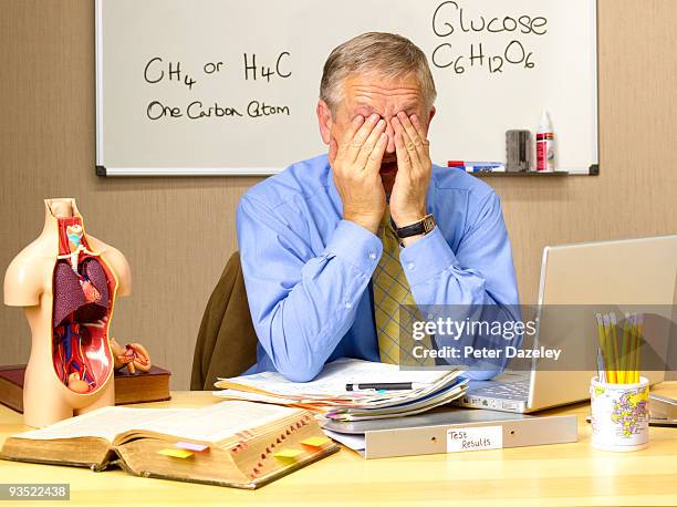 senior science teacher showing stress. - parsons green foto e immagini stock