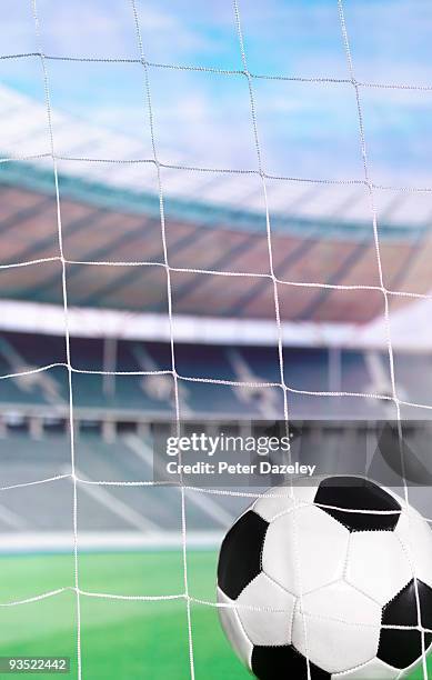 football in the back of net at football stadium - parsons green stock pictures, royalty-free photos & images