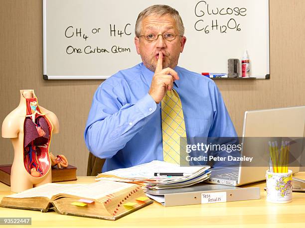 senior science teacher quietening class. - parsons green foto e immagini stock