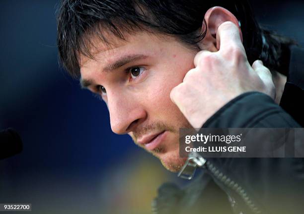 Barcelona's Argentinian forward Lionel Messi listens during a press conference at the Ciutat esportiva Joan Gamper near Barcelona on December 1,...