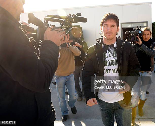 Barcelona's Argentinian forward Lionel Messi leaves the press room after a press conference at the Ciutat esportiva Joan Gamper near Barcelona on...