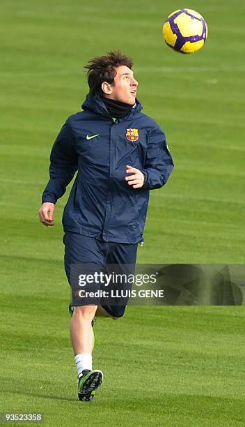 Barcelona's Argentinian forward Lionel Messi takes part in a training session at Ciutat Esportiva Joan Gamper, near Barcelona, on November 27 two...