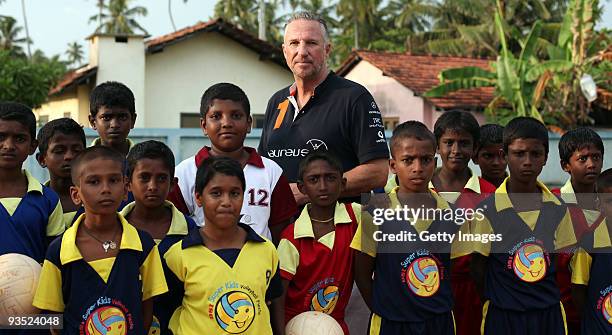 Laureus World Sports Academy member and England cricket legend Sir Ian Botham watches a volleyball game at the Thotagamuwa School as he paid an...