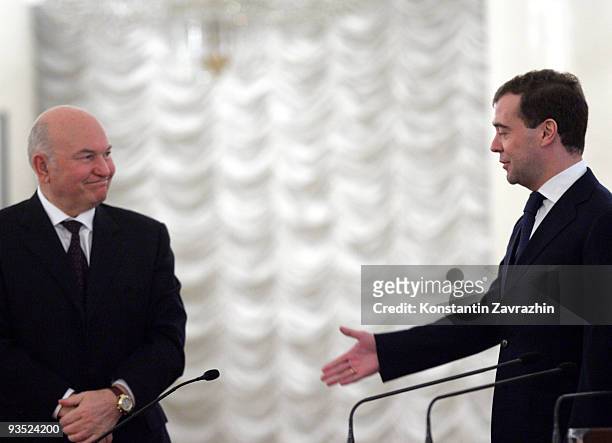 Russian President Dmitry Medvedev greets Moscow Mayor Yuri Luzhkov during the Third World Congress of Compatriots at the Columns Hall December 1,...
