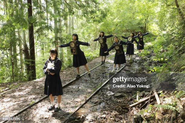 group of female hight school students marching - railroad track stock pictures, royalty-free photos & images