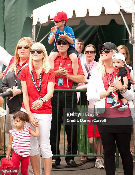 Sam Alexis Woods, Elin Woods, Josefin Nordegrin and Charlie Axel Woods wait for Tiger Woods during the final round of the 2009 AT&T National hosted...