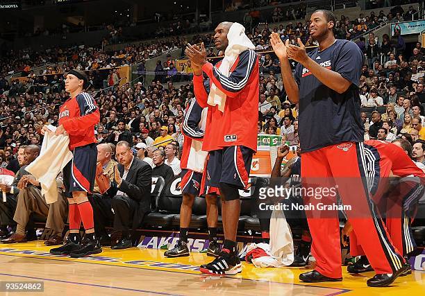 Mike Bibby, Joe Smith, and Jason Collins of the Atlanta Hawks celebrate on the sidelines during the game against the Los Angeles Lakers on November...