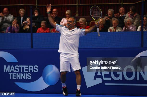 Mansour Bahrami of Iran celebrates winning a game with Jeremy Bates of Great Britain against Peter McNamara and Mark Woodforde of Australia during...
