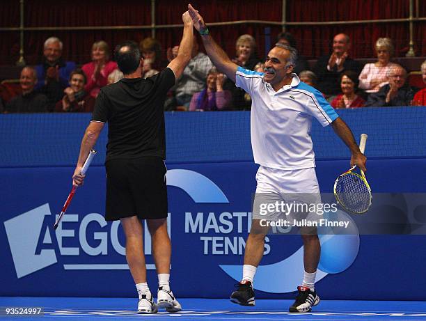 Mansour Bahrami of Iran celebrate winning a game with Jeremy Bates of Great Britain against Peter McNamara and Mark Woodforde of Australia during day...