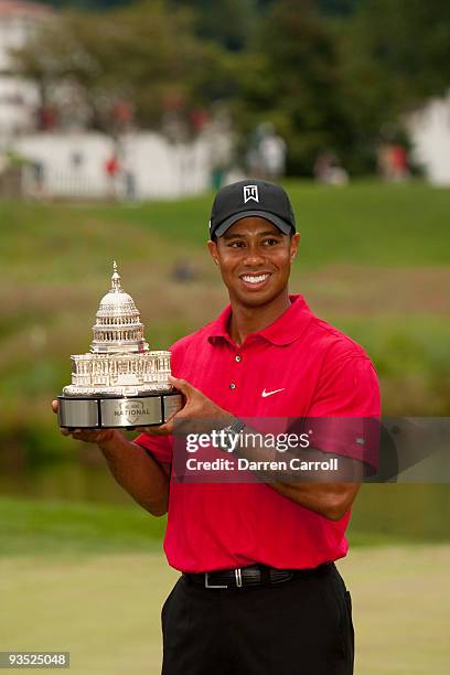 Tiger Woods poses with the trophy after winning the 2009 AT&T National hosted by Tiger Woods, held at Congressional Country Club on July 5, 2009 in...