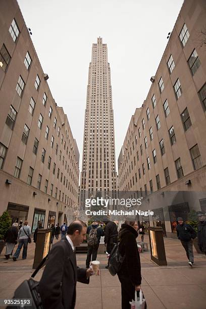Pedestrians pass the General Electric building at 30 Rockefeller Plaza , the headquarters of NBC, on December 1, 2009 in New York City. General...