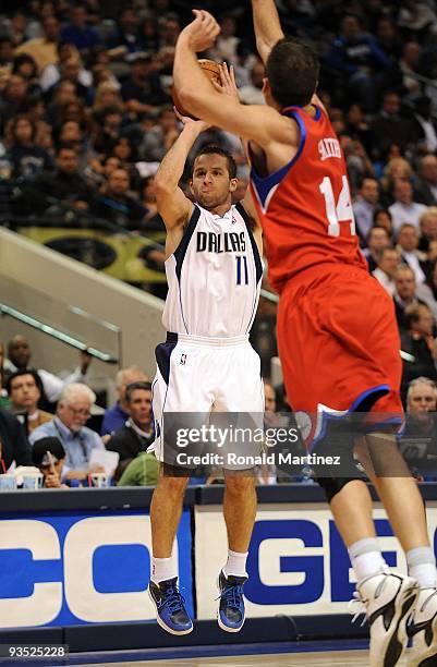 Guard Jose Juan Barea of the Dallas Mavericks takes a shot in front of Jason Smith of the Philadelphia 76ers on November 30, 2009 at American...