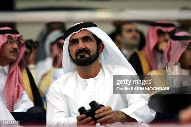 Crown Prince of Dubai Sheikh Mohammed bin Rached Al Maktoum attends the richest horse race in the world, the Dubai World Cup, 26 March 2005 in Dubai....