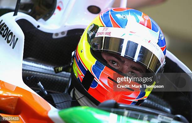 Paul Di Resta of Great Britain and team Force India in the team garage at the Circuito De Jerez on December 1, 2009 in Jerez de la Frontera, Spain.