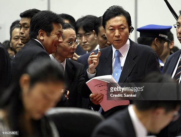 Japanese Prime Minister Yukio Hatoyama listens to the explanation from Yukio Edano , a diet member and a chief of a government panel working groups...