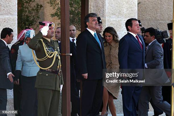 Turkish President Abdullah Gul and his wife Hayrunnisa Gul are received by Jordan's King Abdullah and his wife Queen Rania upon their arrival for a...