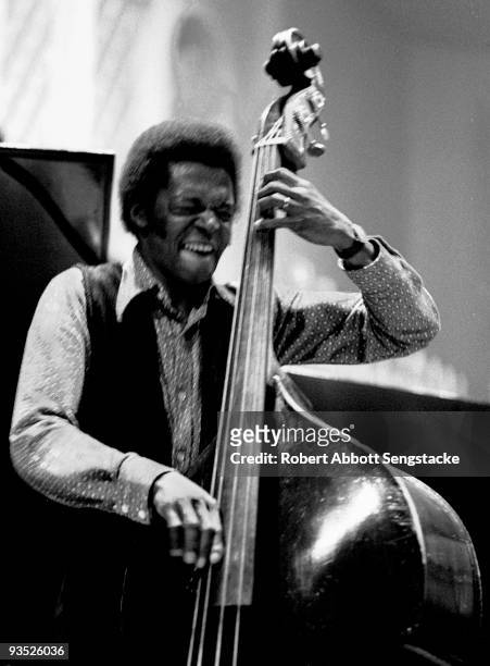 Portrait of jazz bassist Jimmy Garrison performing with Alice Coltrane during a concert at Fisk University, Nashville, TN, 1971.
