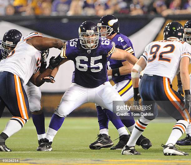 John Sullivan of the Minnesota Vikings blocks during an NFL game against the Chicago Bears at the Mall of America Field at Hubert H. Humphrey...