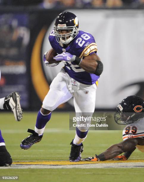 Adrian Peterson of the Minnesota Vikings carries the ball during an NFL game against the Chicago Bears at the Mall of America Field at Hubert H....