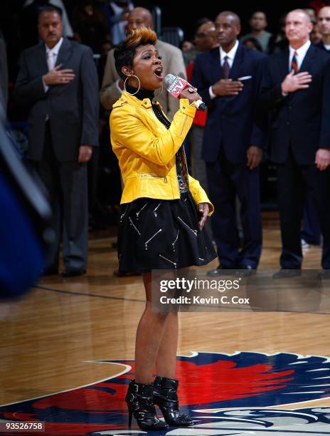 Grammy Award-winning singer and songwriter Kandi Burruss performs the National Anthem before the game between the Atlanta Hawks and the Orlando Magic...