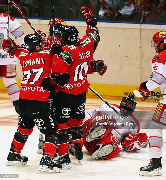 Thomas Brandl of Haie is celebrated after scoring his team's first goal during the Deutsche Eishockey Liga game between Koelner Haie and Hannover...