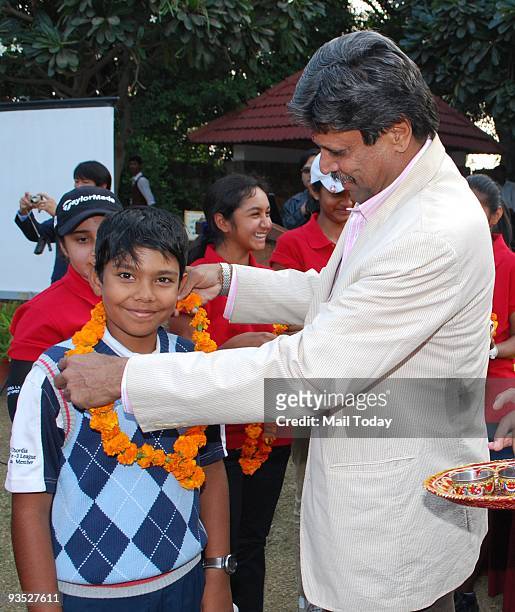 Kapil Dev with the participants at a press meet to launch the junior Golf tournament at Classic Golf course on Tuesday, November 24, 2009.