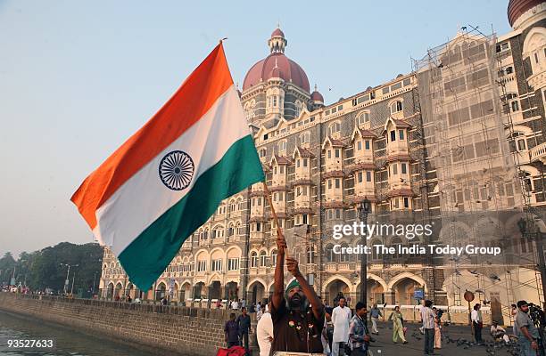 People pay homage to the victims of November 26 terror attacks on its first anniversary in Mumbai.