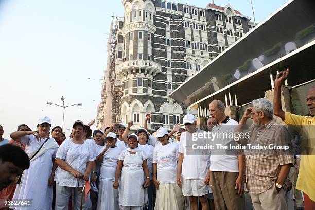 People pay homage to the victims of November 26 terror attacks on its first anniversary in Mumbai.