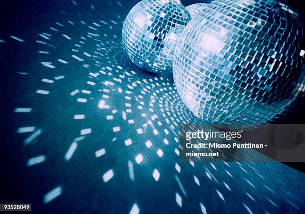 mirror balls on the floor - diskokugel stock-fotos und bilder
