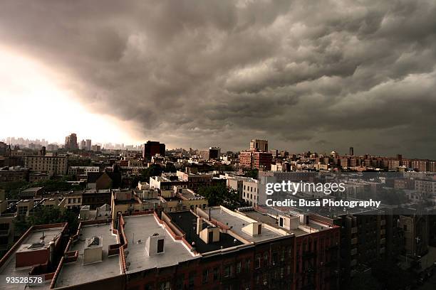 summer storm on the roofs of harlem - harlem new york stock pictures, royalty-free photos & images