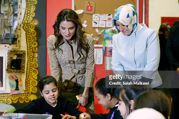 Queen Rania of Jordan and the Turkish President's wife Hayrunnisa Gul visit the Children's Museum on December 1, 2009 in Amman, Jordan.