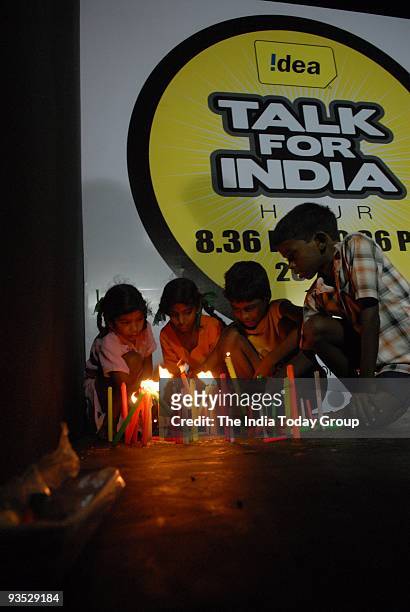 Children light candles to pledge their support for country's Internal Security forces in their efforts to fight terrorism and paid their tributes to...