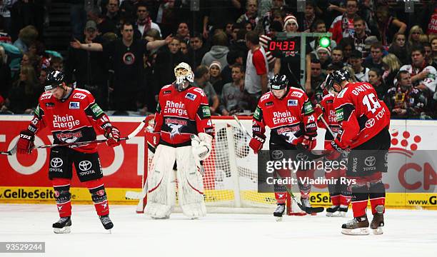 Haie players look dejected after conceding the 5:6 goal at the extra time during the Deutsche Eishockey Liga game between Koelner Haie and Hannover...