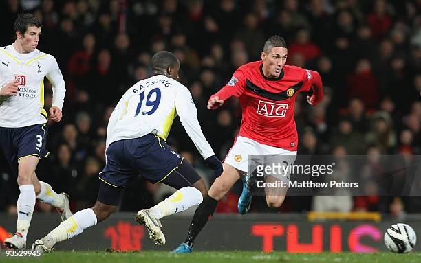 Federico Macheda of Manchester United clashes with Sebastien Bassong of Tottenham Hotspur during the Carling Cup Quarter Final match between...
