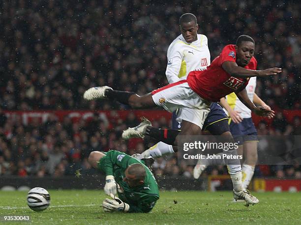 Danny Welbeck of Manchester United clashes with Heurelho Gomes of Tottenham Hotspur during the Carling Cup Quarter-Final match between Manchester...