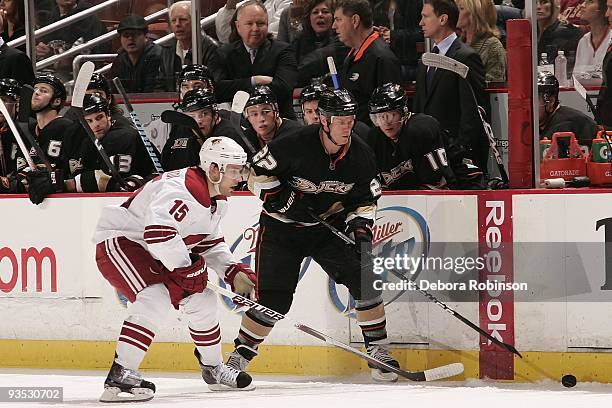 Matthew Lombardi of the Phoenix Coyotes reaches for the puck against Todd Marchant of the Anaheim Ducks during the game on November 29, 2009 at Honda...