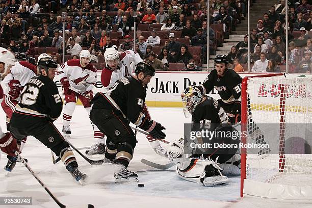 Jean-Sebastien Giguere and Nick Boynton of the Anaheim Ducks defend the net against the Phoenix Coyotes during the game on November 29, 2009 at Honda...