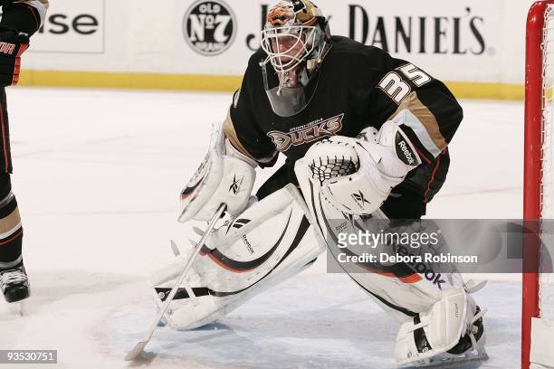 Jean-Sebastien Giguere of the Anaheim Ducks defends in the crease against the Phoenix Coyotes during the game on November 29, 2009 at Honda Center in...